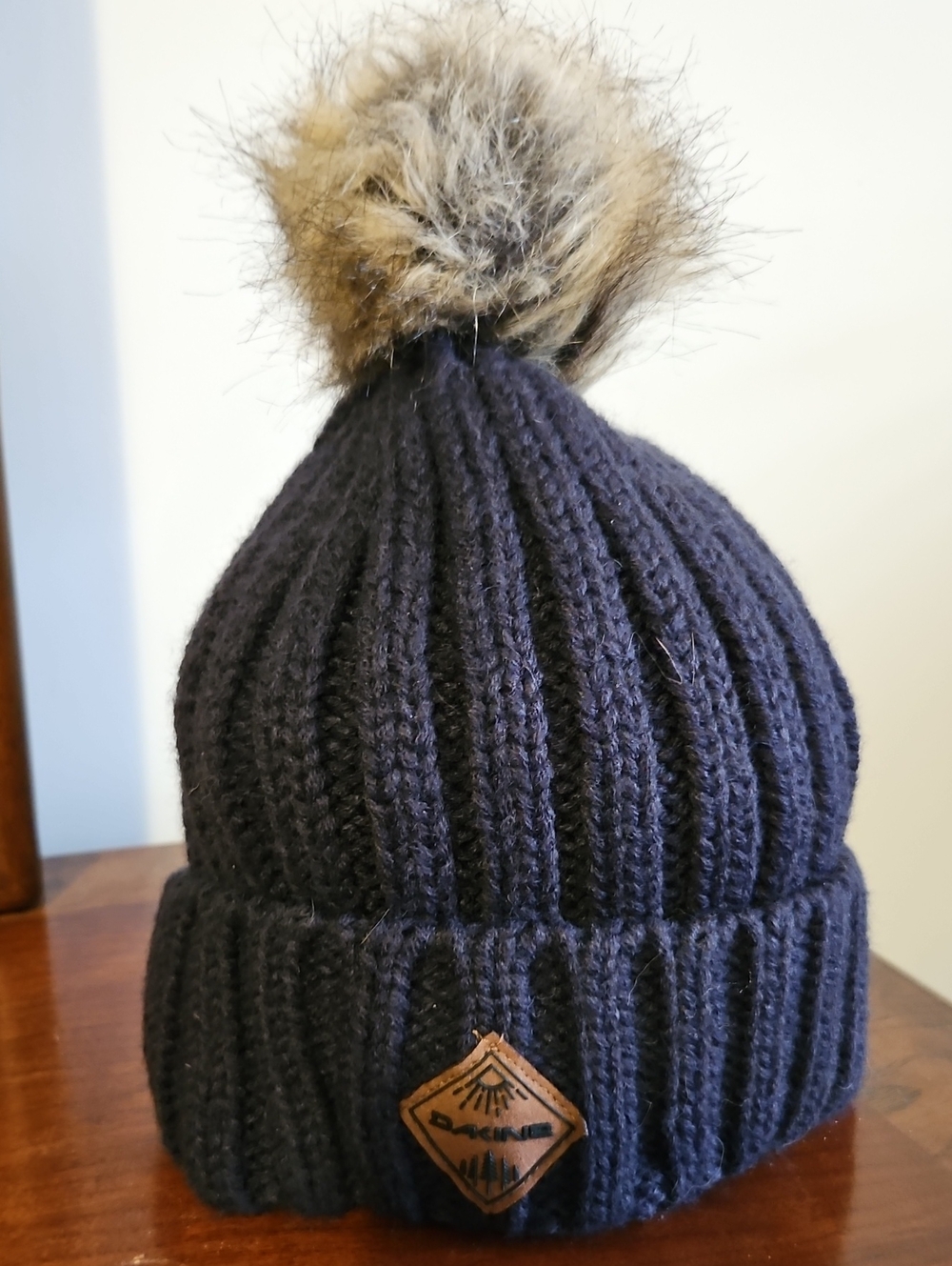 Dakine Women's Navy Knit Beanie with Brown Faux Fur Pompom